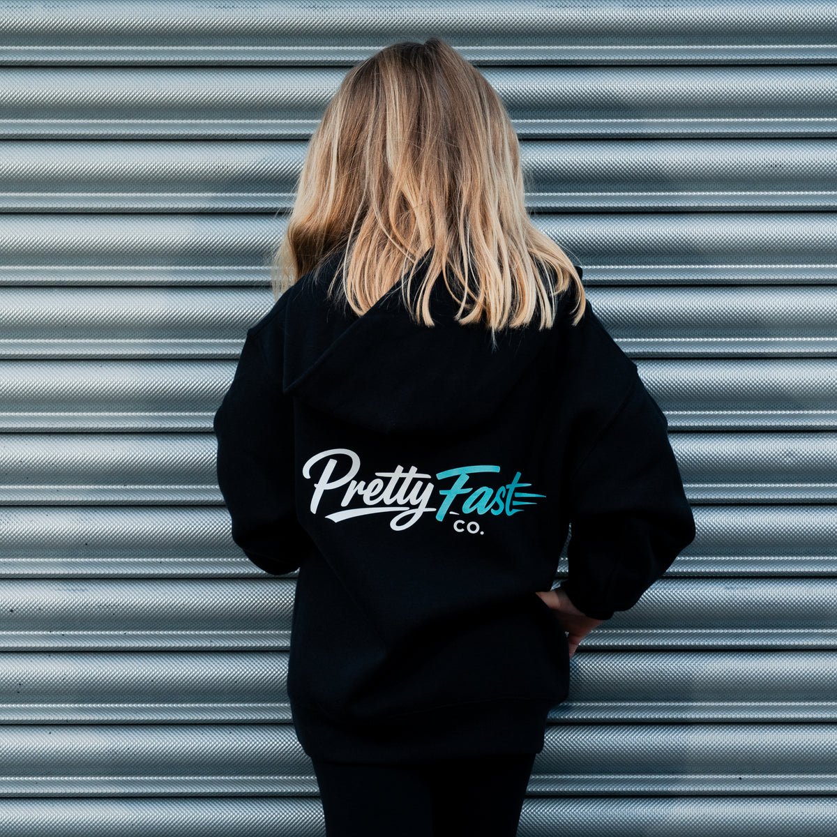 PrettyFastCo Kids Original Hoodie In Black With Turquoise Logo