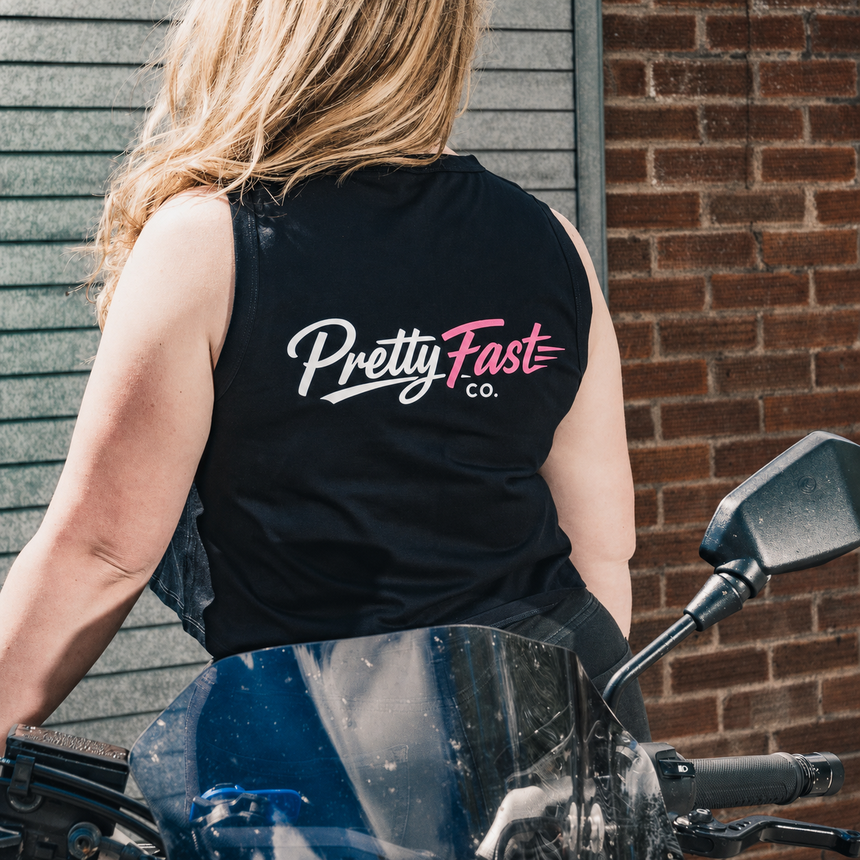 PrettyFastCo Original Cropped Vest in Black With Pink Logo