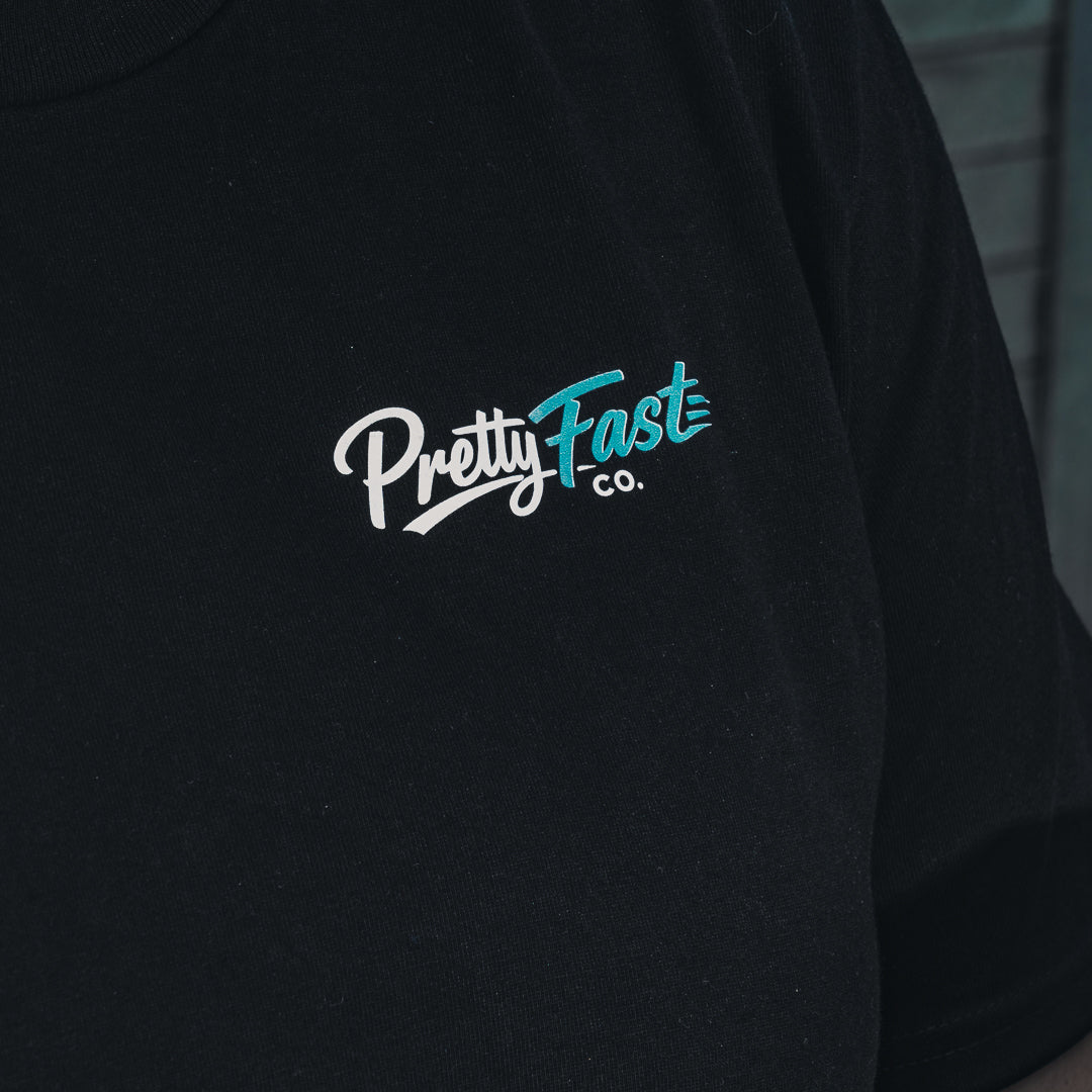 PrettyFastCo Original Cropped Black Tee With Turquoise Logo