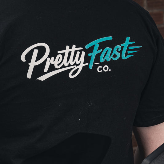 PrettyFastCo Original Cropped Black Tee With Turquoise Logo