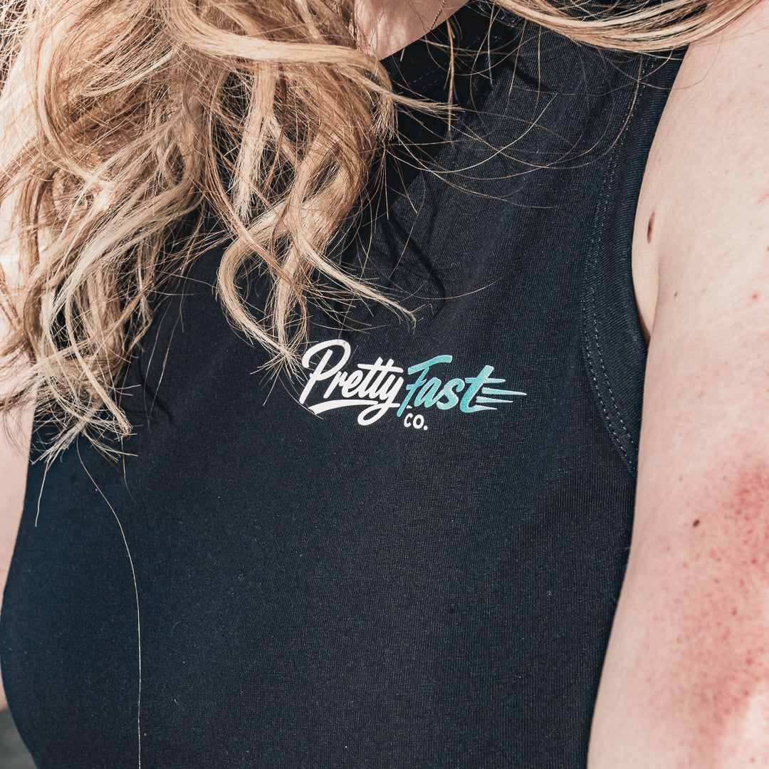 PrettyFastCo Original Cropped Vest In Black With Turquoise Logo