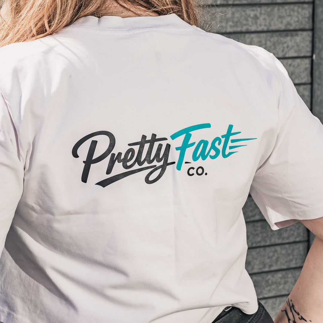 PrettyFastCo Original Cropped White Tee With Turquoise Logo