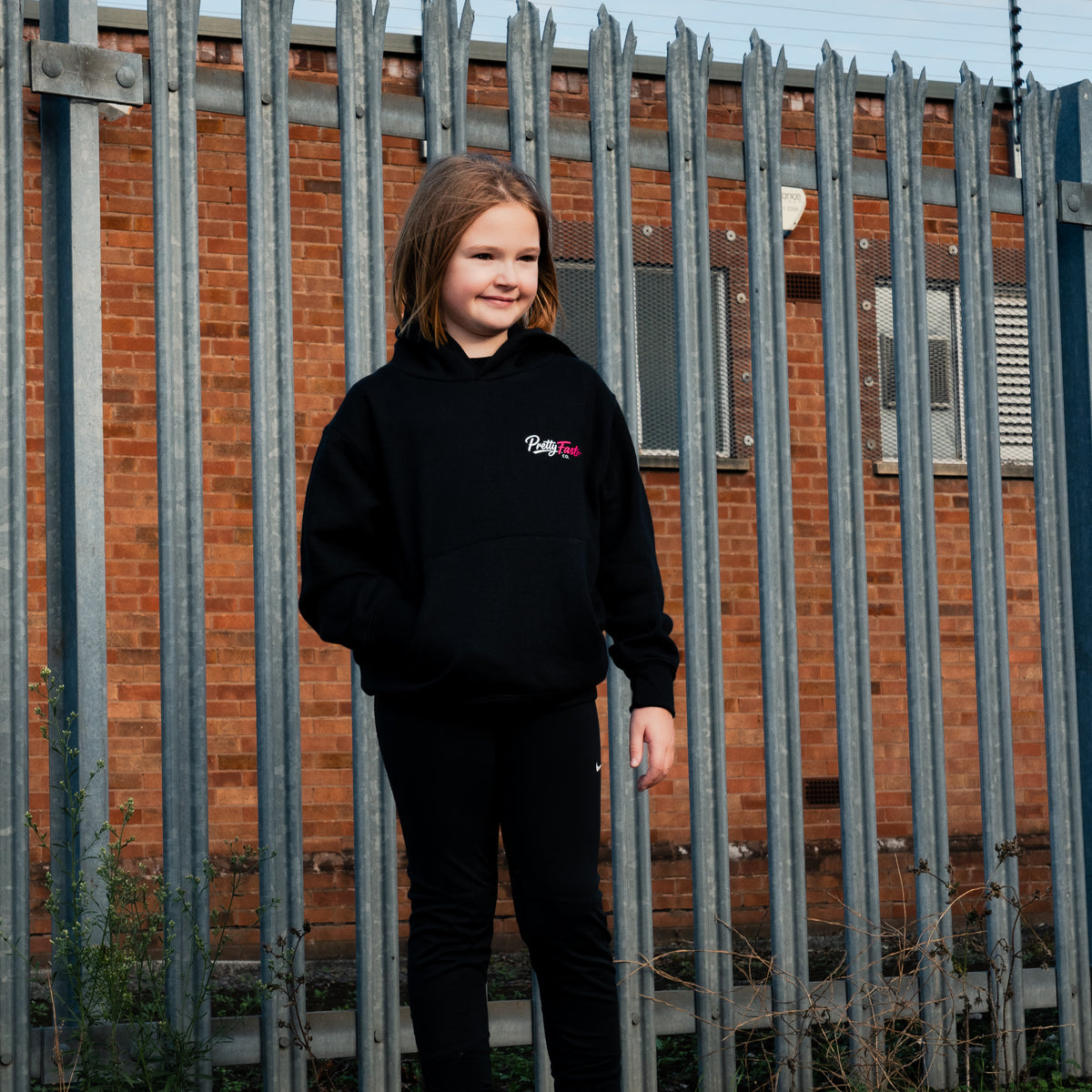 PrettyFastCo Kids Original Hoodie In Black With Pink Logo